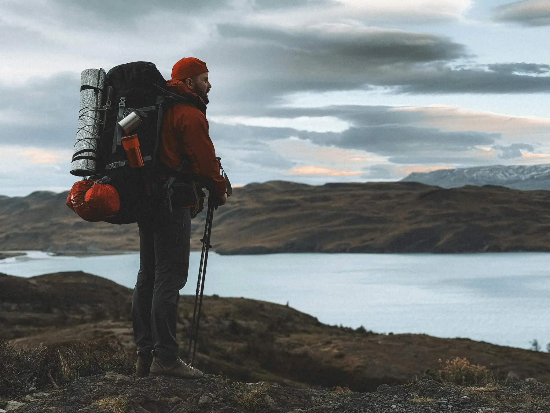 Hiker overlooking Patagonian fjord