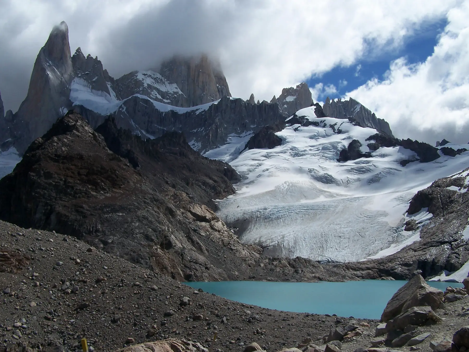 Turquoise waters of Laguna Sucia with hanging glaciers above