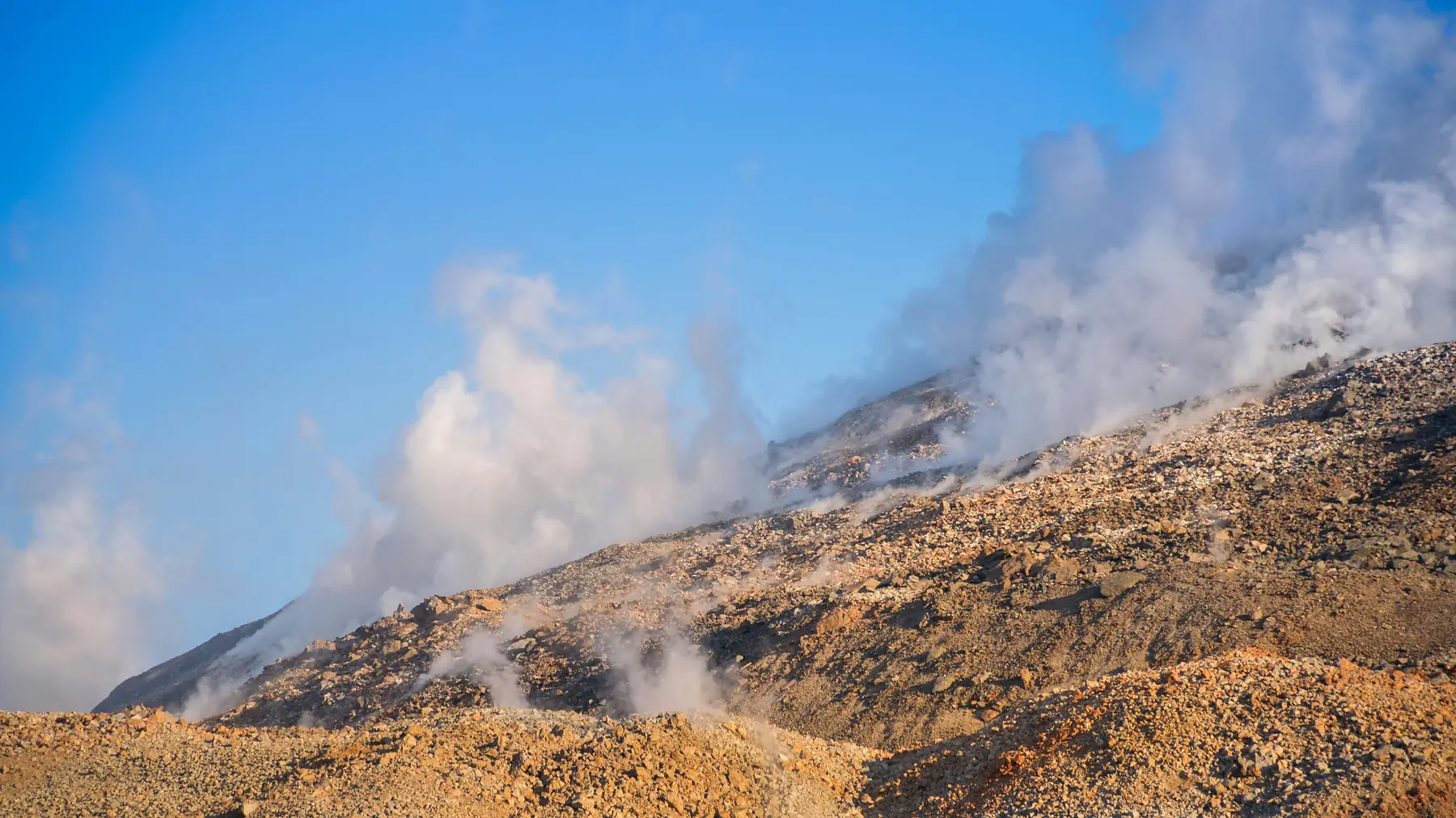 Volcanic landscapes and lush rainforest surrounding Chaiten