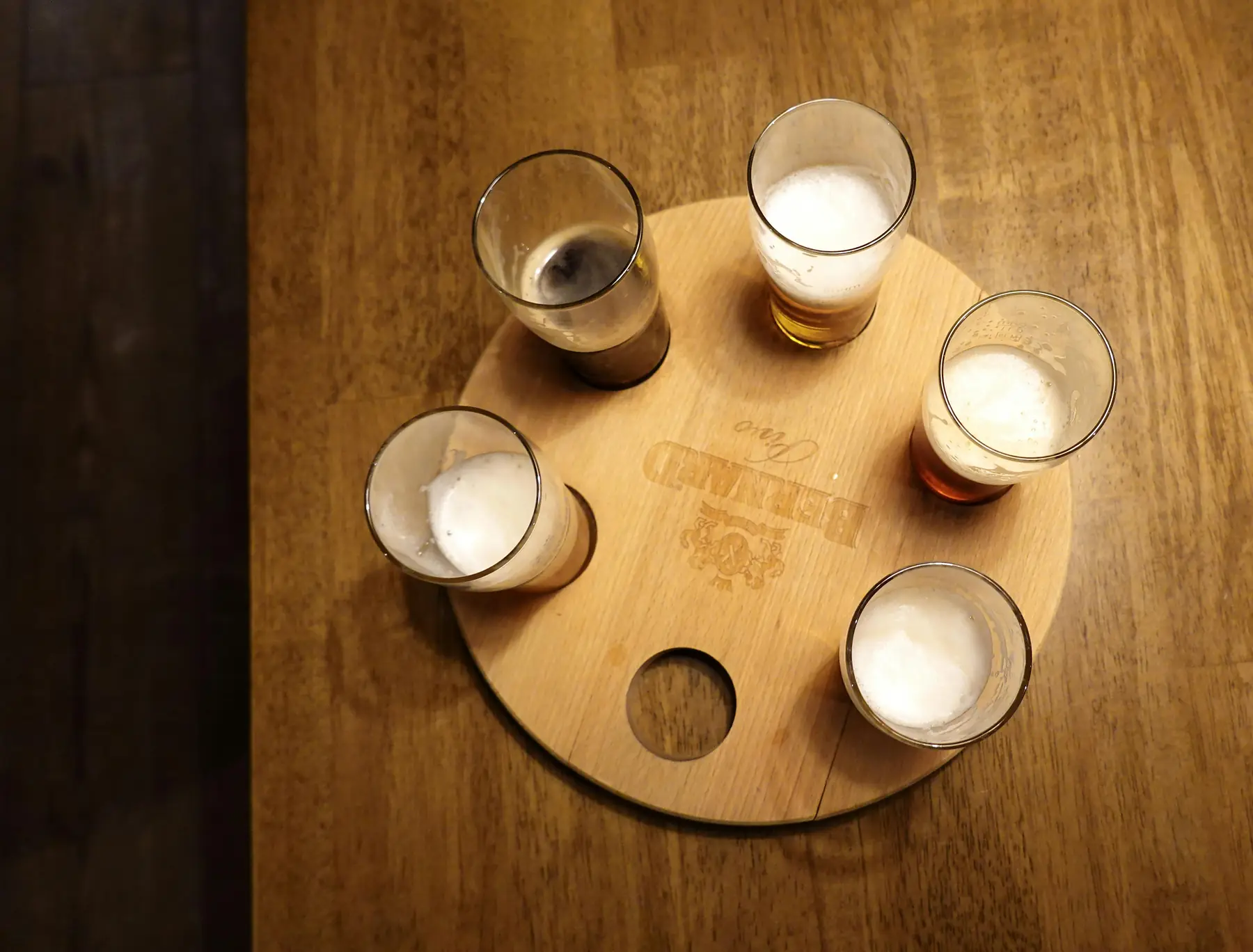A flight of craft beers lined up at a Bariloche microbrewery.