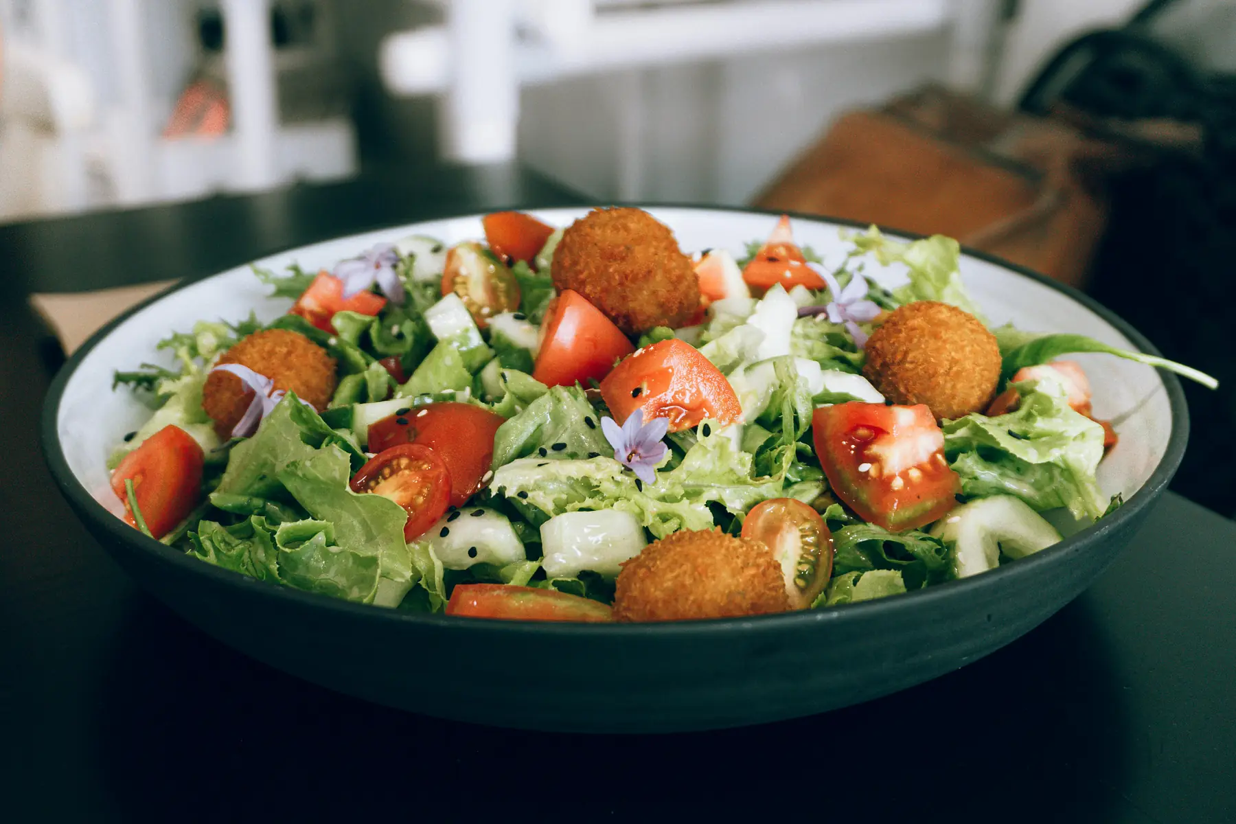Plant-based empanadas and fresh salad at a Patagonian cafe.