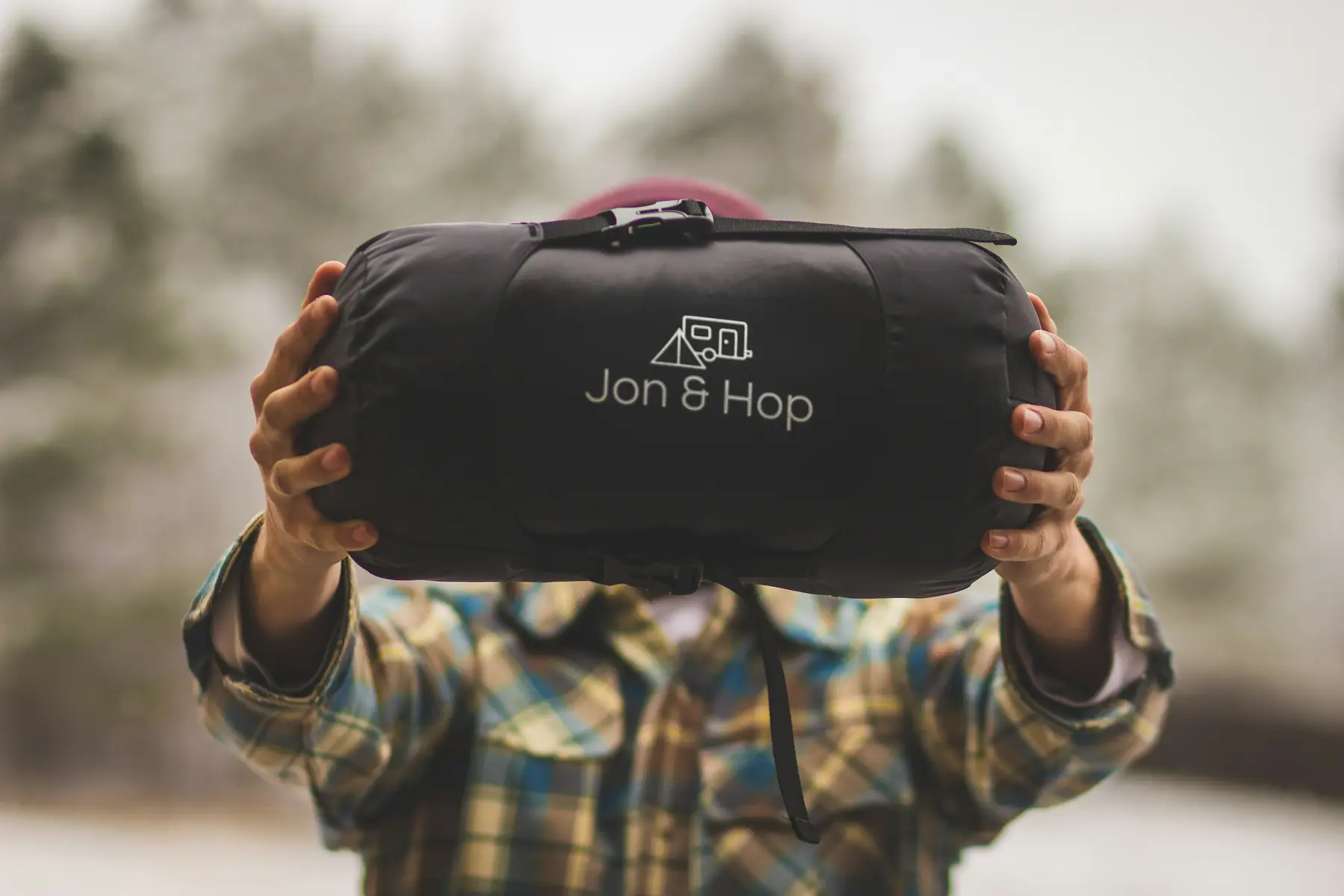 A sleeping bag unrolled on a camping mat inside a backcountry tent in Patagonia.