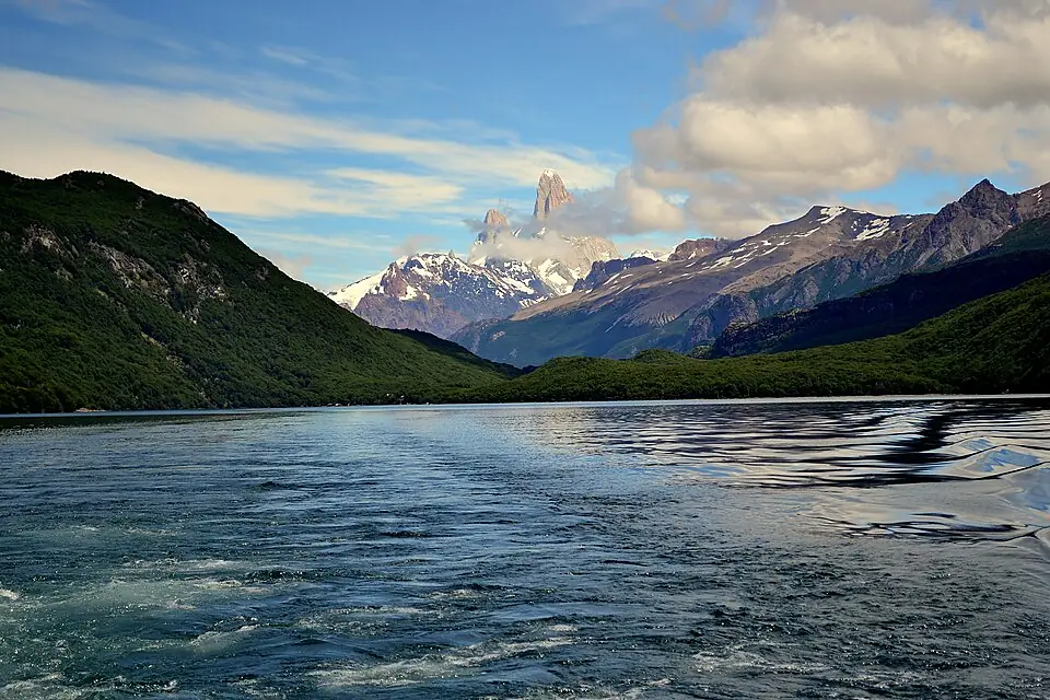 The Huemul Glacier hanging above the emerald lagoon at Lago del Desierto