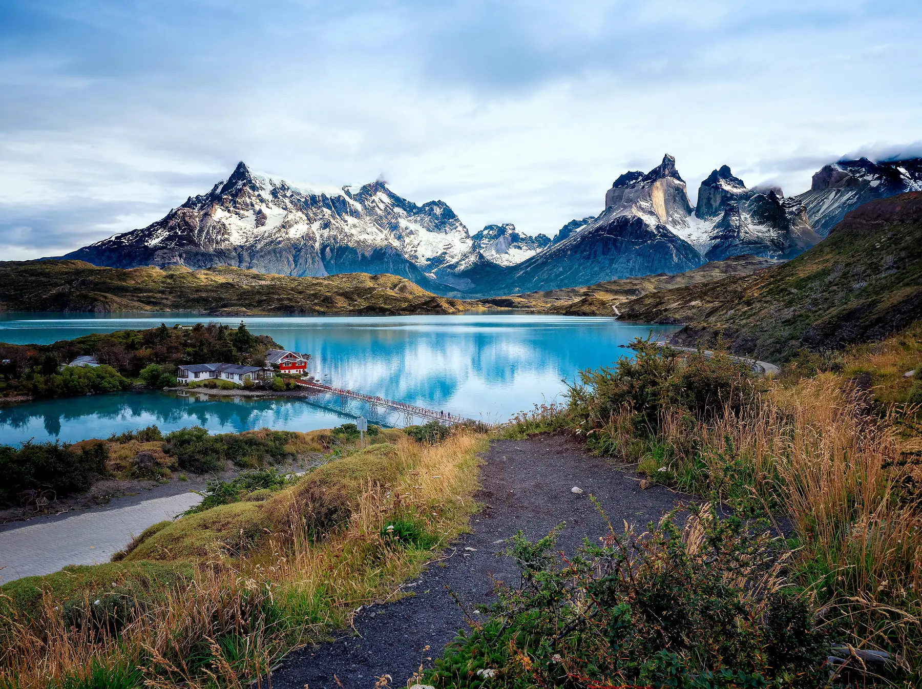 The snow-dusted peaks of Torres del Paine at golden hour.