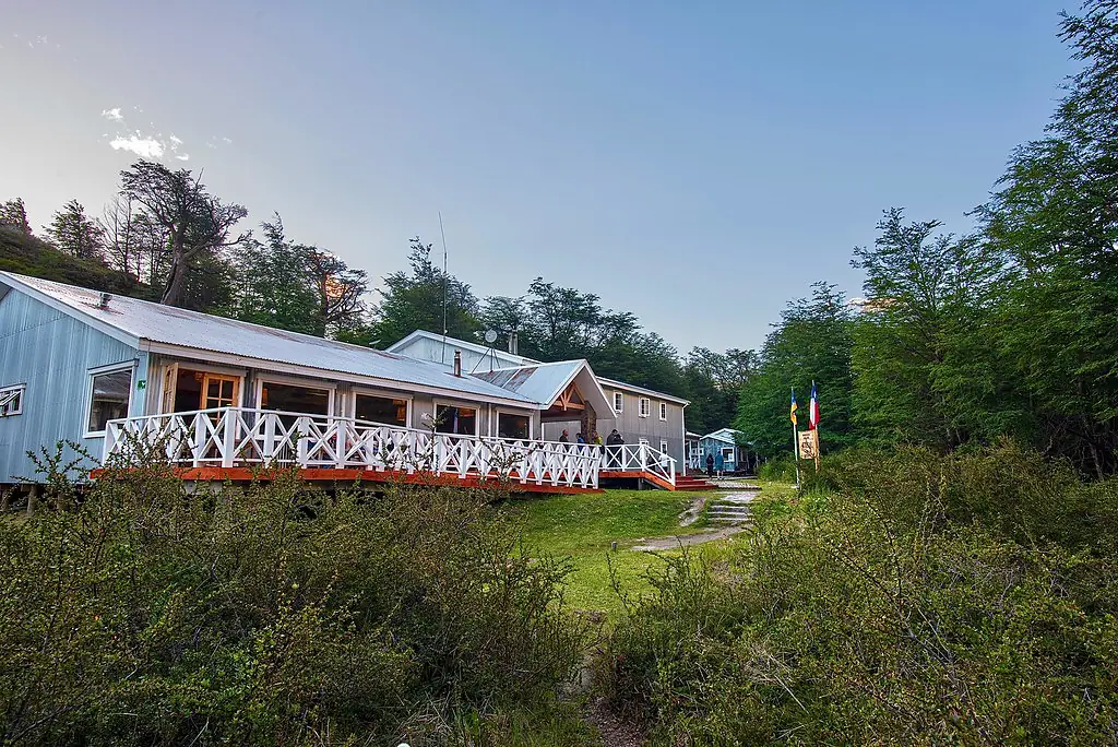 The communal dining area of a W Trek refugio at sunset.