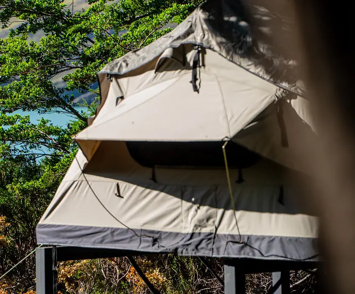 The communal dining area of a W Trek refugio at sunset.